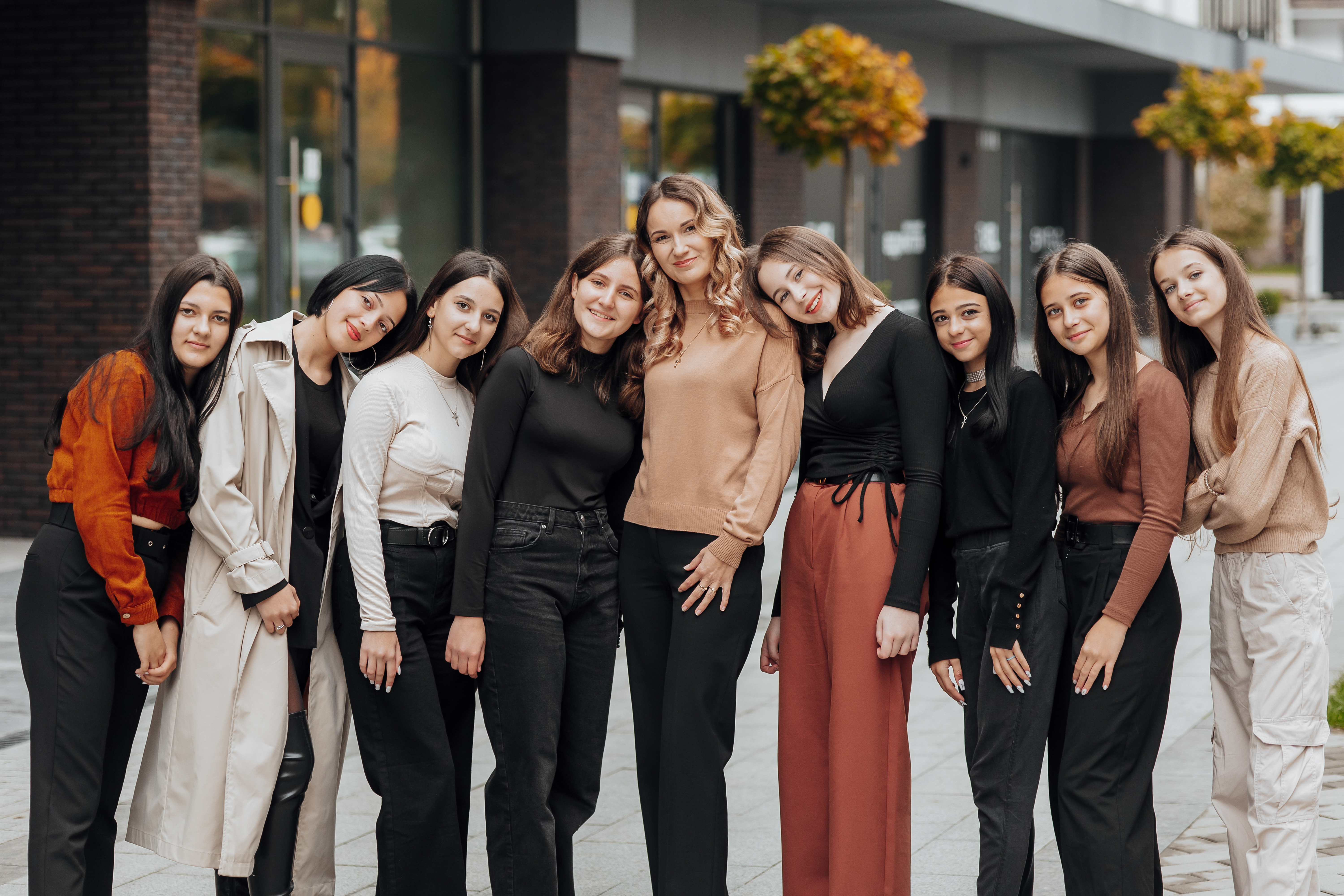 group-smiling-happy-teenage-friends-wearing-casual-clothes-spending-time-together-posing-talking-with-each-other-near-college-building-autumn-day