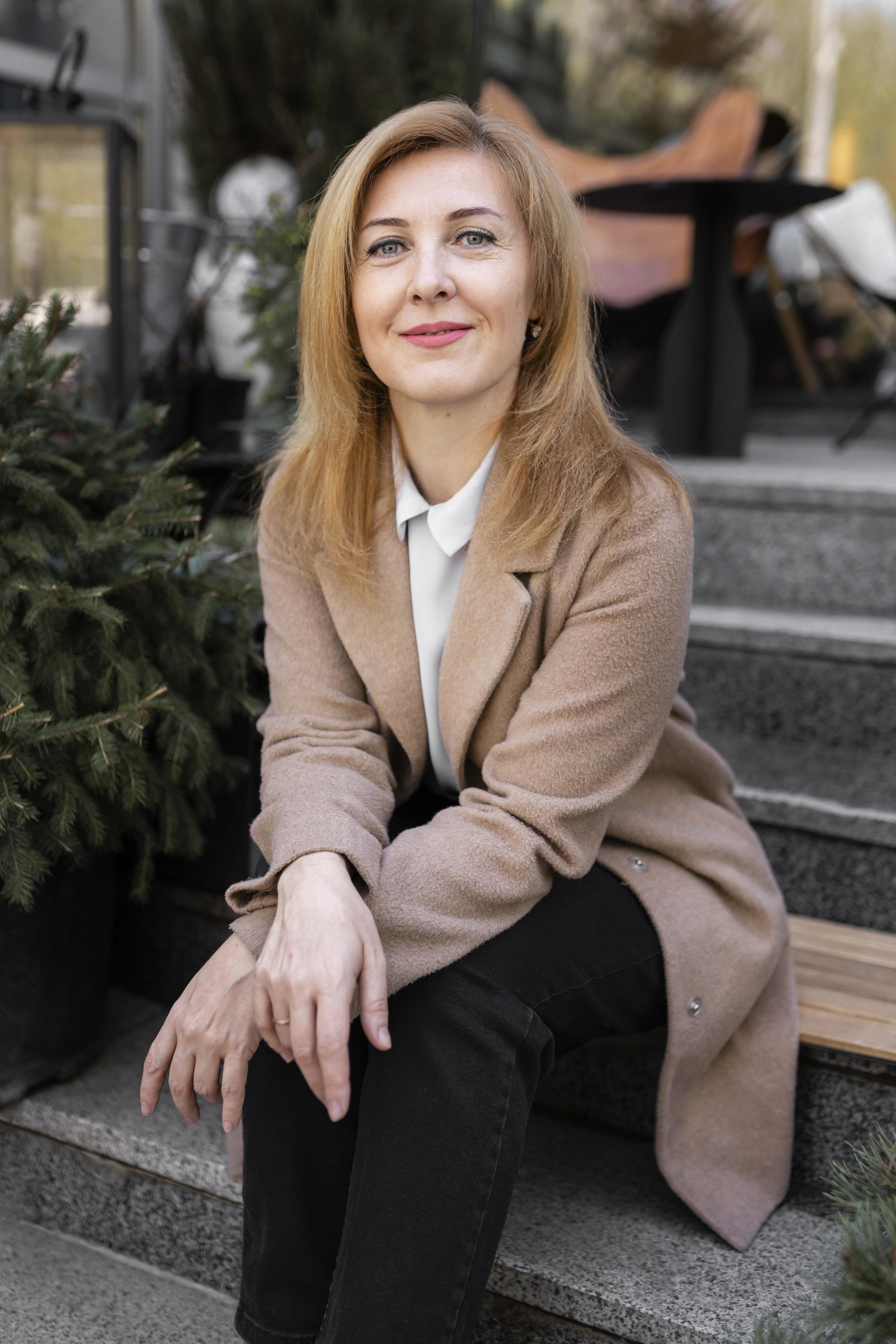 happy-middle-aged-woman-relaxing-outdoors